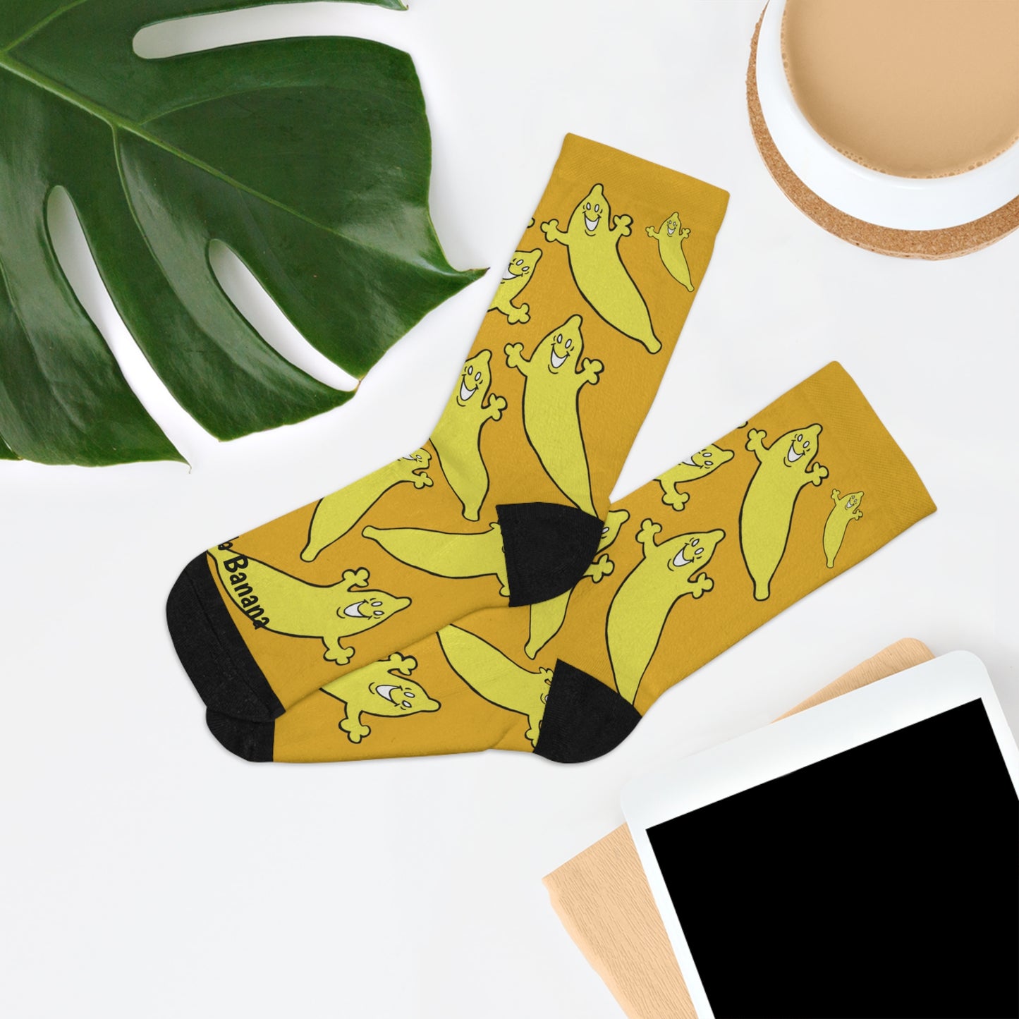 "WE'RE ALL BANANAS HERE" Unisex Crew Socks by The Dumb Banana